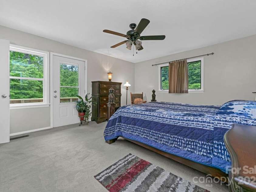 94 Sweetwater Lane, Pisgah Forest, NC 28768.  MLS# CAR4124609, YatesRealty ID 2911. Primary bedroom