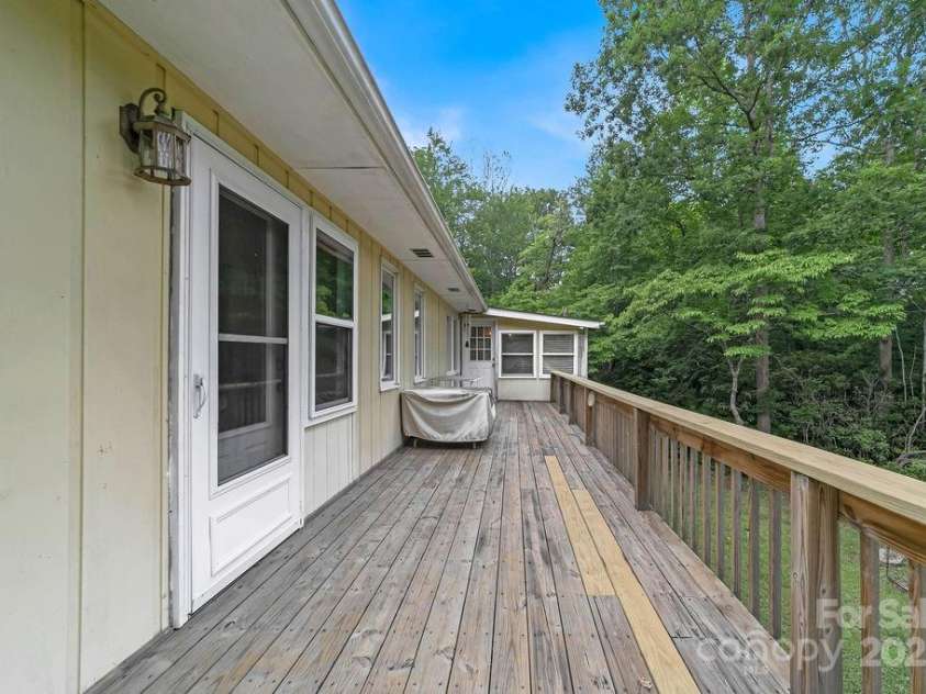 94 Sweetwater Lane, Pisgah Forest, NC 28768.  MLS# CAR4124609, YatesRealty ID 2911. Wide deck