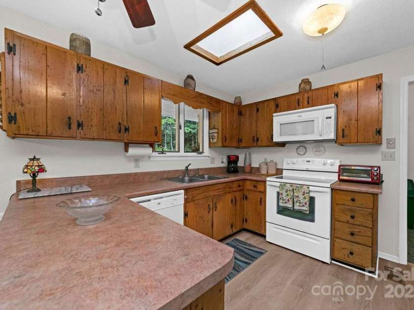 94 Sweetwater Lane, Pisgah Forest, NC 28768.  MLS# CAR4124609, YatesRealty ID 2911. Wormy wood chestnut cabinets