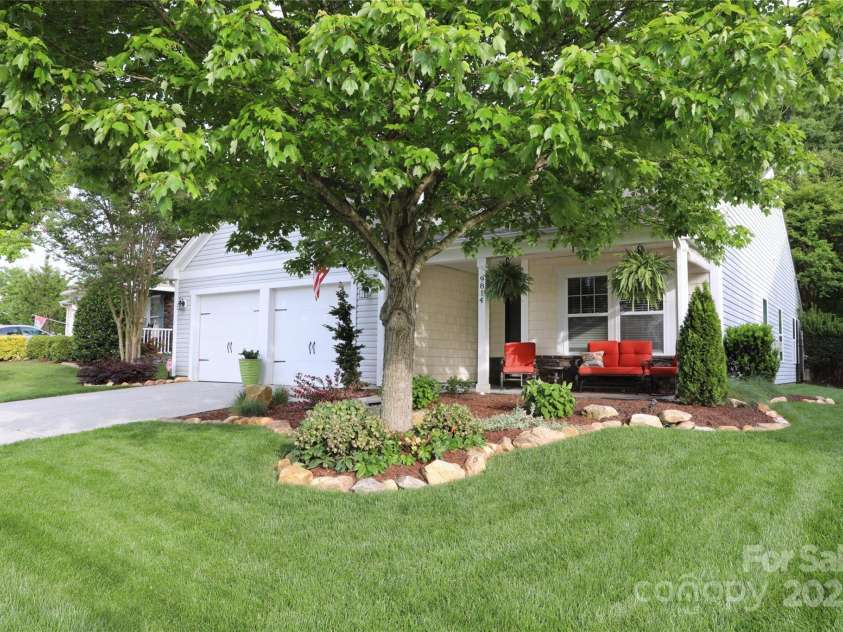 9814 Fernspray Road, Charlotte, NC 28215.  MLS# CAR4254340, YatesRealty ID 29114. Beautiful landscaping and covered front porch
