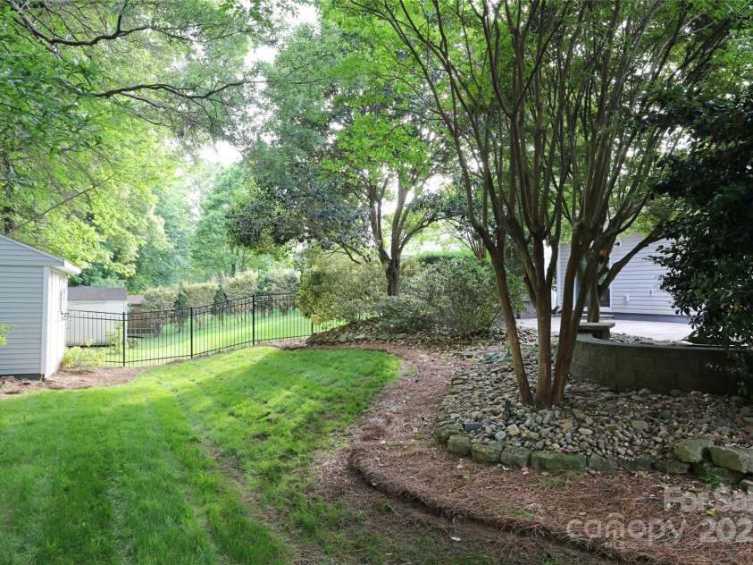 9814 Fernspray Road, Charlotte, NC 28215.  MLS# CAR4254340, YatesRealty ID 29114. Fully fenced rear yard also offers a storage shed
