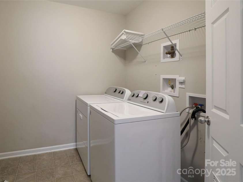 9814 Fernspray Road, Charlotte, NC 28215.  MLS# CAR4254340, YatesRealty ID 29114. Laundry room is spacious