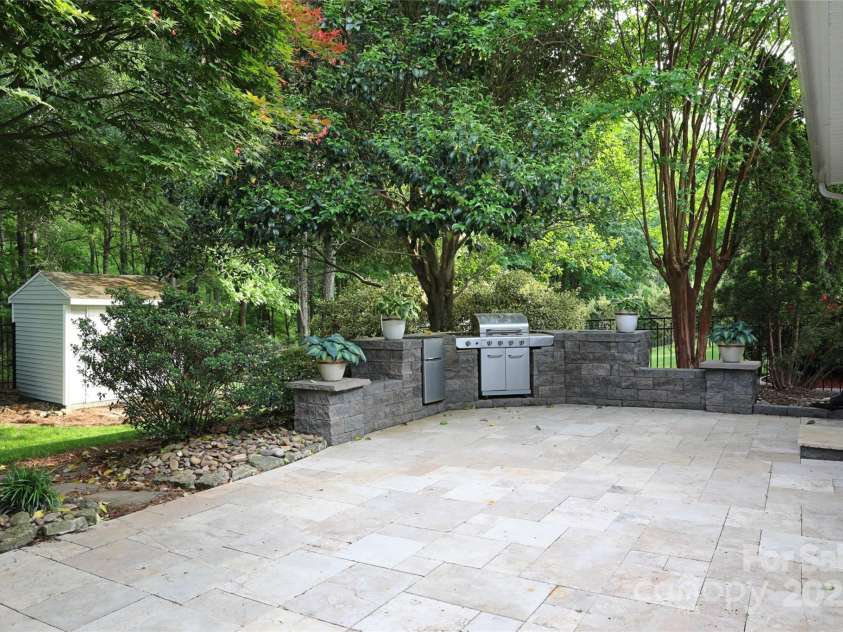 9814 Fernspray Road, Charlotte, NC 28215.  MLS# CAR4254340, YatesRealty ID 29114. Outdoor kitchen and spacious paver patio