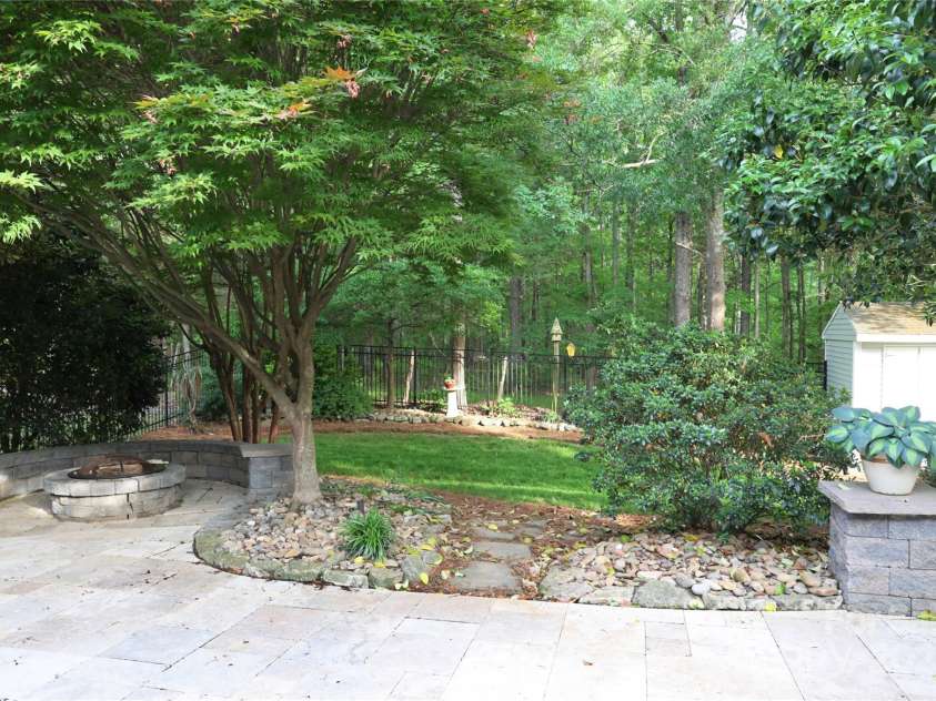 9814 Fernspray Road, Charlotte, NC 28215.  MLS# CAR4254340, YatesRealty ID 29114. Paver patio path leads to beautifully shaded lawn