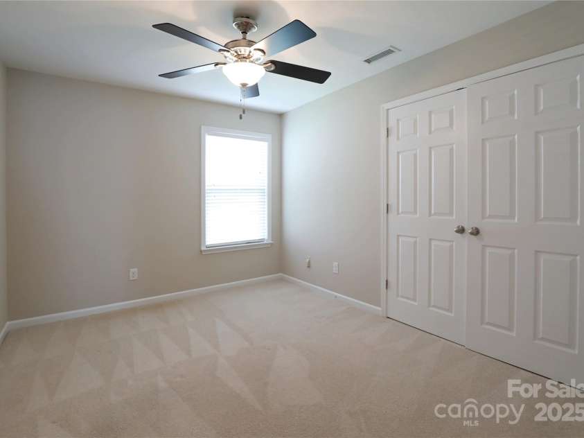 9814 Fernspray Road, Charlotte, NC 28215.  MLS# CAR4254340, YatesRealty ID 29114. Secondary bedroom down hall from hall bath