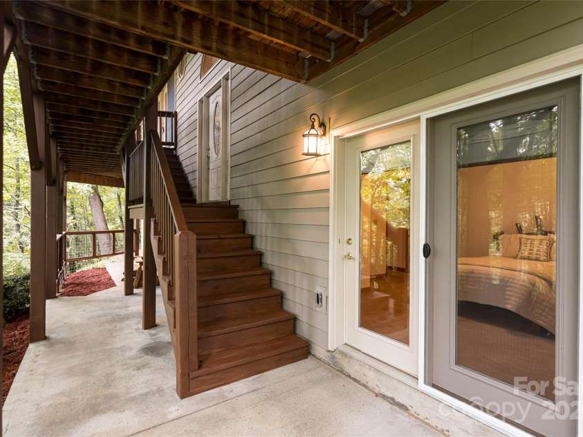 380 Allison Drive, Maggie Valley, NC 28751.  MLS# CAR4273769, YatesRealty ID 29120. Patio outside bedroom on lower level