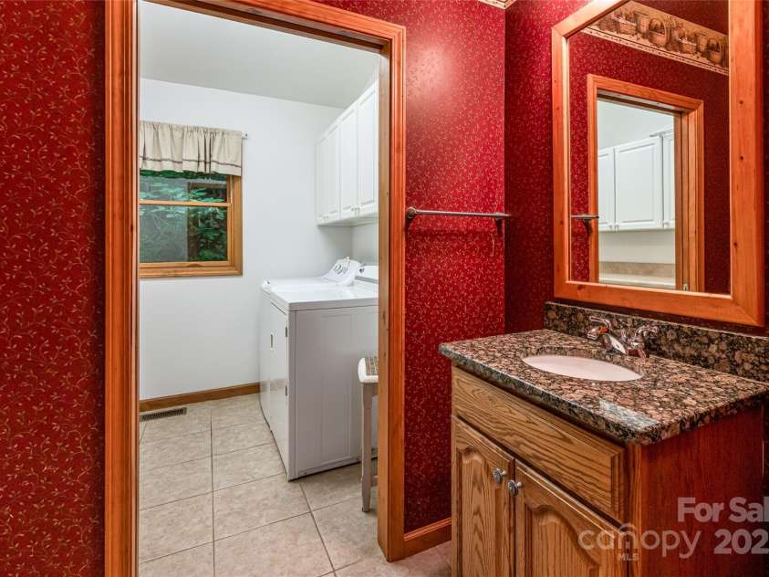 380 Allison Drive, Maggie Valley, NC 28751.  MLS# CAR4273769, YatesRealty ID 29120. Powder room opens to laundry room