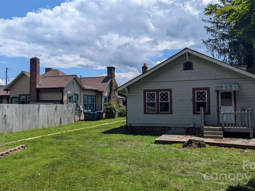 43 & 53 Cherry Street, Waynesville, NC 28786.  MLS# CAR4287122, YatesRealty ID 29122. Rear of 43 Cherry with 53 behind the fence