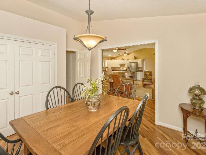 15 Beaverdam Knoll Road, Asheville, NC 28804.  MLS# CAR4283730, YatesRealty ID 29131. From this perspective, you can see the large storage closet for the dining room--ideal for dish and linen storage. The kitchen and great room are visible in the background.