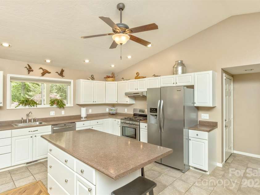 15 Beaverdam Knoll Road, Asheville, NC 28804.  MLS# CAR4283730, YatesRealty ID 29131. The appliances and large pantry are all just steps away from each other, making cooking a breeze.