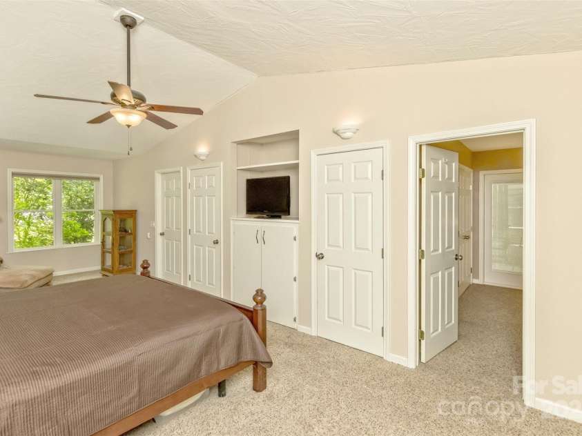 15 Beaverdam Knoll Road, Asheville, NC 28804.  MLS# CAR4283730, YatesRealty ID 29131. The leftmost door is the primary suite hallway which has closets and entry to the primary bathroom. The rightmost door is the office/nursery.