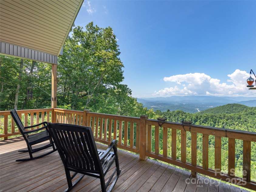 1070 Gold City Lane, Franklin, NC 28734.  MLS# CAR4282550, YatesRealty ID 29132. Soak in breathtaking, long-range mountain views from your covered deck—perfect for morning coffee, evening sunsets, and everything in between. This is true mountain living at its finest.