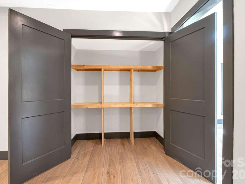 35 Timberview Drive, Arden, NC 28704.  MLS# CAR4373385, YatesRealty ID 29135. Convenient built-in pantry closet offering ample kitchen storage.