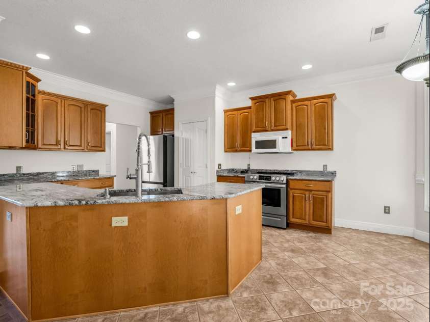 124 Shadow View Drive, Leicester, NC 28748.  MLS# CAR4273794, YatesRealty ID 29136. Large, updated kitchen with plenty of counter + cabinet space and stainless steel appliances. 