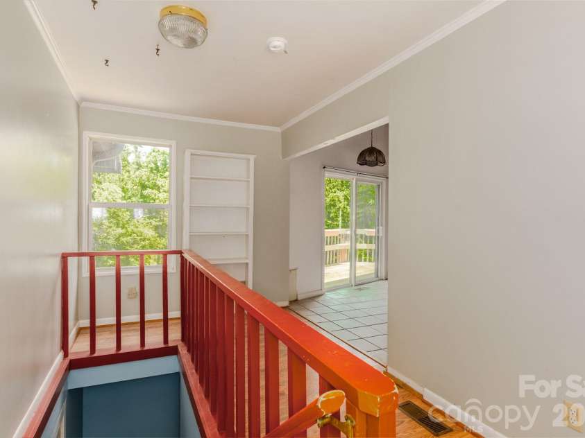 295 Richmond Road, Bakersville, NC 28705.  MLS# CAR4387768, YatesRealty ID 29139. Entrance foyer with steps to finished basement and kitchen to your right.