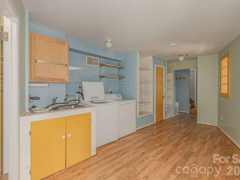 295 Richmond Road, Bakersville, NC 28705.  MLS# CAR4387768, YatesRealty ID 29139. Large laundry room in basement.