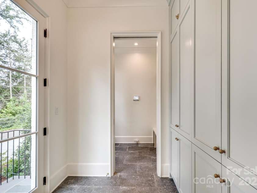 418 Ellsworth Road, Charlotte, NC 28211.  MLS# CAR4276851, YatesRealty ID 29139. Friend's side entrance, amazing built in cabinets for storage and mud room with pocket door