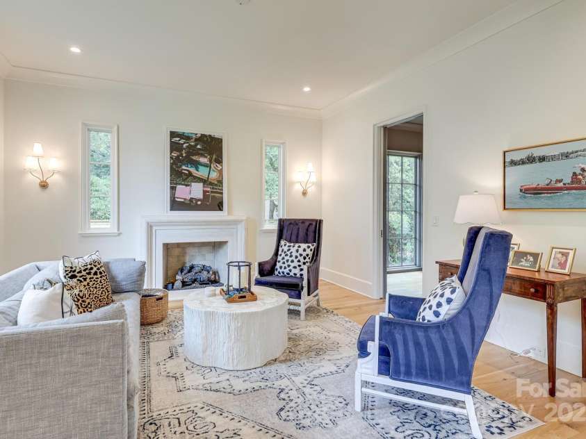418 Ellsworth Road, Charlotte, NC 28211.  MLS# CAR4276851, YatesRealty ID 29139. Living room with fireplace, lovely lighting throughout