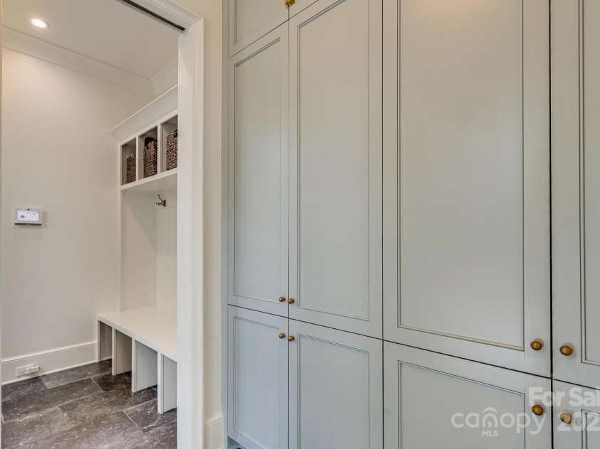 418 Ellsworth Road, Charlotte, NC 28211.  MLS# CAR4276851, YatesRealty ID 29139. Side entrance /cabinets/mudroom