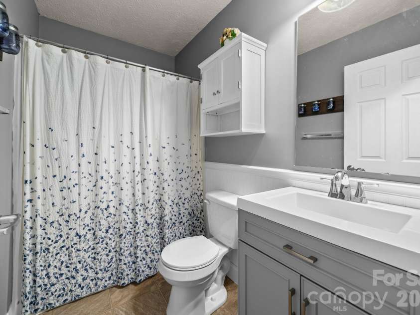 121 James Street, Clyde, NC 28721.  MLS# CAR4340631, YatesRealty ID 2914. Guest Bathroom