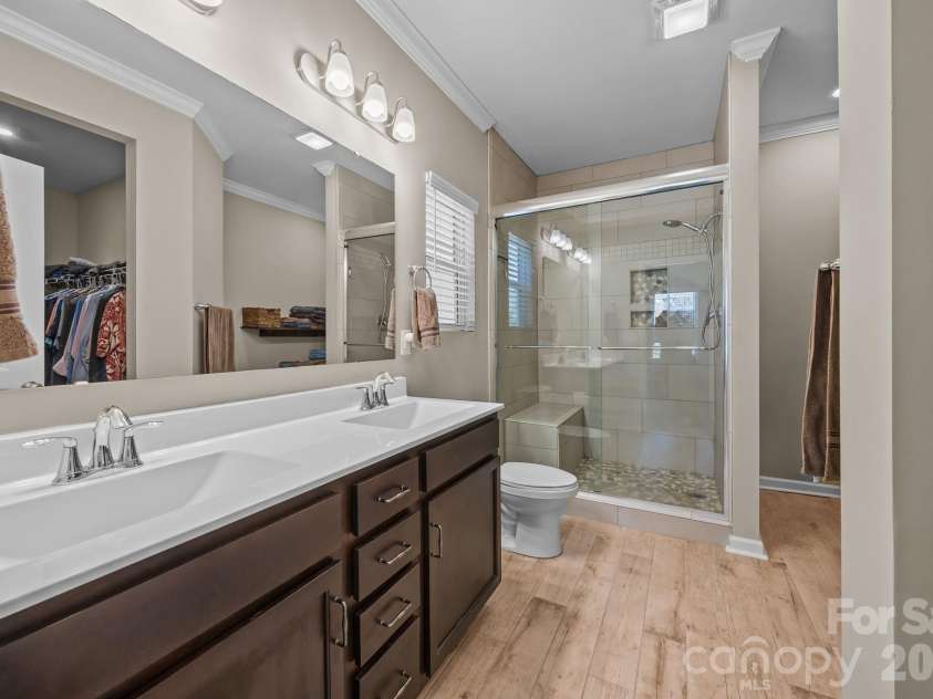 204 Old Harbor Drive, Mount Gilead, NC 27306.  MLS# CAR4335591, YatesRealty ID 2914. Primary Bath...Owner removed tub and added nice updated full size shower. Created more storage area to the right of the shower.