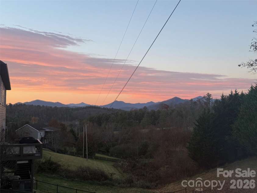 1 Little Oak Road, Leicester, NC 28748.  MLS# CAR4378692, YatesRealty ID 29140. Beautiful Sunset from Wrap around Deck