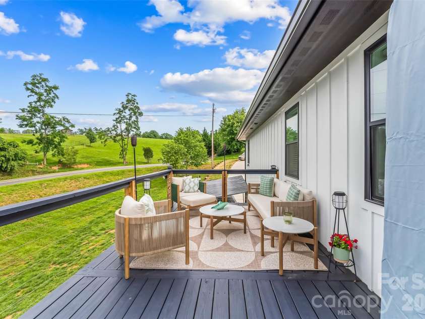 1 Little Oak Road, Leicester, NC 28748.  MLS# CAR4378692, YatesRealty ID 29140. Large  wrap around deck