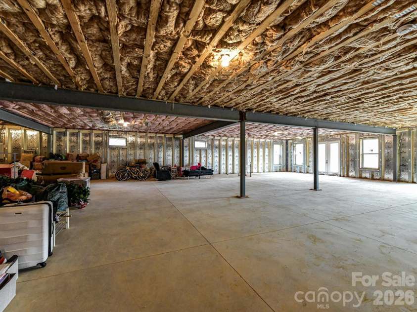4987 Wildlife Lane, Sherrills Ford, NC 28673.  MLS# CAR4353607, YatesRealty ID 29143. Expansive unfinished basement offering a wide-open layout with endless potential for customization and additional living space.