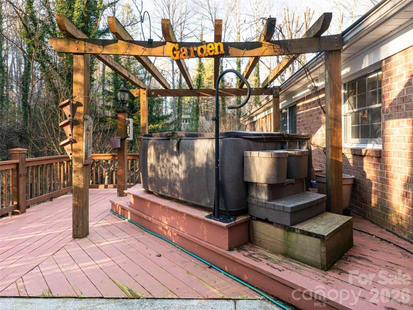 100 Wolf Shoals Drive, Hendersonville, NC 28739.  MLS# CAR4333977, YatesRealty ID 29146. Great deck with hot tub.
