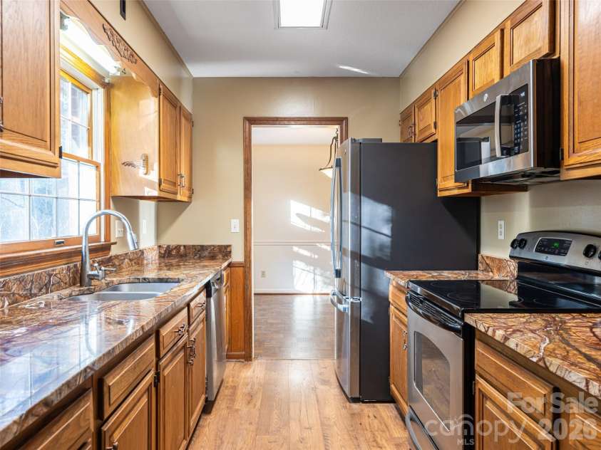100 Wolf Shoals Drive, Hendersonville, NC 28739.  MLS# CAR4333977, YatesRealty ID 29146. Well equipped galley kitchen.