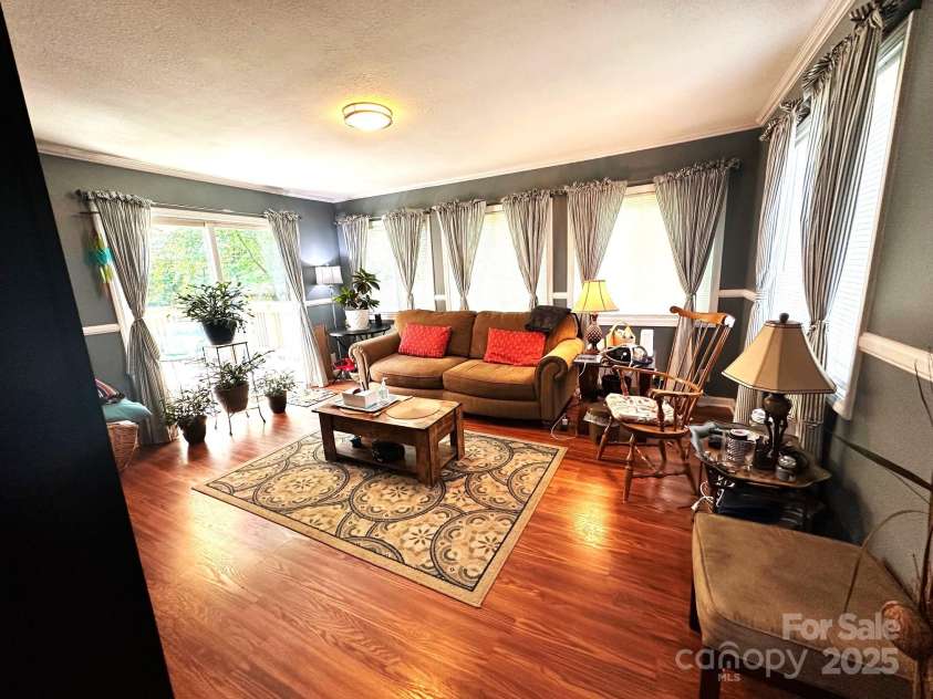 25 Norman Road, Fletcher, NC 28732.  MLS# CAR4278825, YatesRealty ID 29147. Den addition to house
