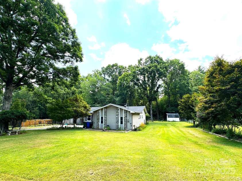 25 Norman Road, Fletcher, NC 28732.  MLS# CAR4278825, YatesRealty ID 29147. Large level lot