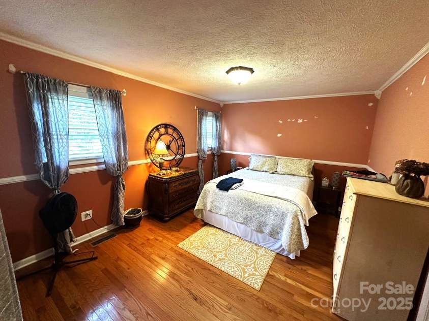 25 Norman Road, Fletcher, NC 28732.  MLS# CAR4278825, YatesRealty ID 29147. Primary bedroom
