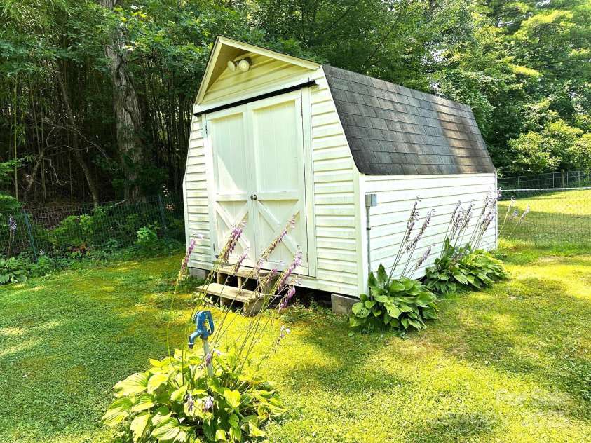 25 Norman Road, Fletcher, NC 28732.  MLS# CAR4278825, YatesRealty ID 29147. Storage building conveys