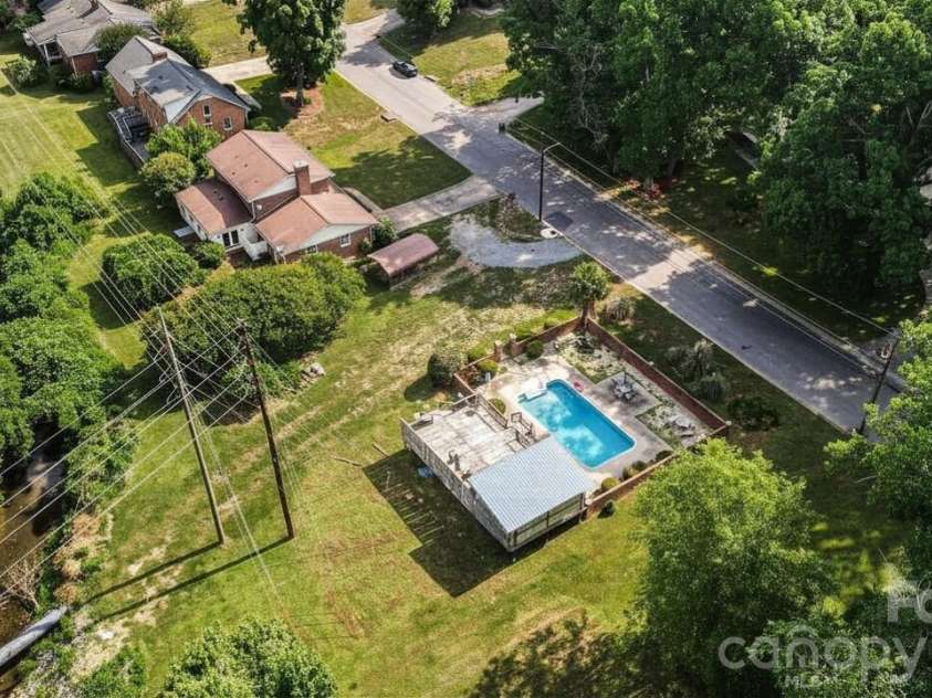 312 Windsor Drive, Shelby, NC 28150.  MLS# CAR4360104, YatesRealty ID 29151. Another aerial view *Pool color has been virtually edited*