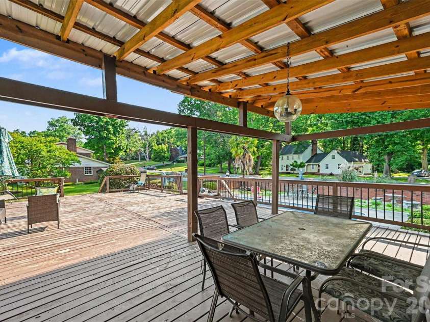 312 Windsor Drive, Shelby, NC 28150.  MLS# CAR4360104, YatesRealty ID 29151. The huge deck includes a covered area - great for outdoor dining!