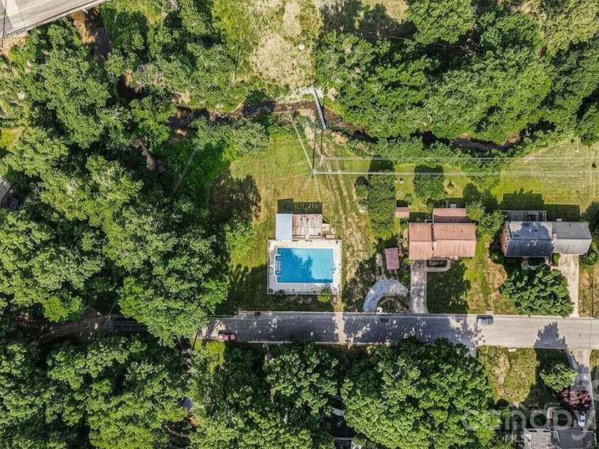 312 Windsor Drive, Shelby, NC 28150.  MLS# CAR4360104, YatesRealty ID 29151. The property includes 3 parcels for a total of ~1.57 acres! *Pool color has been virtually edited*