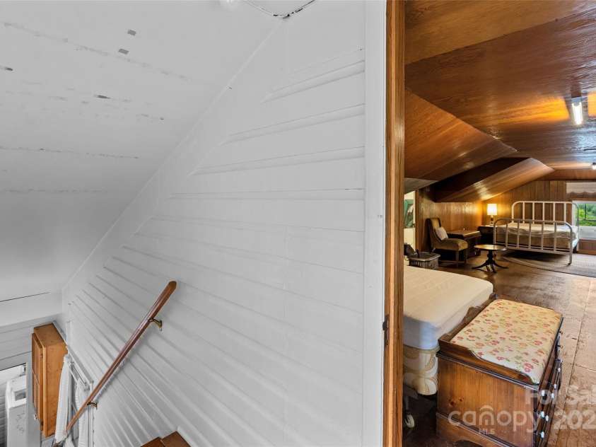 23 & 25 Oteen Park Place, Asheville, NC 28805.  MLS# CAR4287838, YatesRealty ID 29157. #AtticSpaceStairway leading to the attic space that spans the entire front of the duplex.