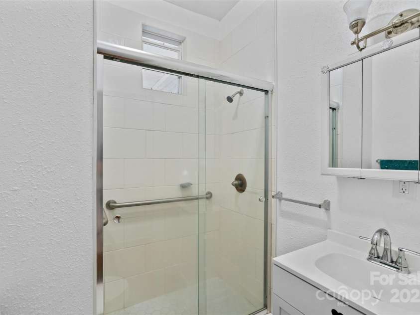 23 & 25 Oteen Park Place, Asheville, NC 28805.  MLS# CAR4287838, YatesRealty ID 29157. The bathroom in unit 23 is updated.