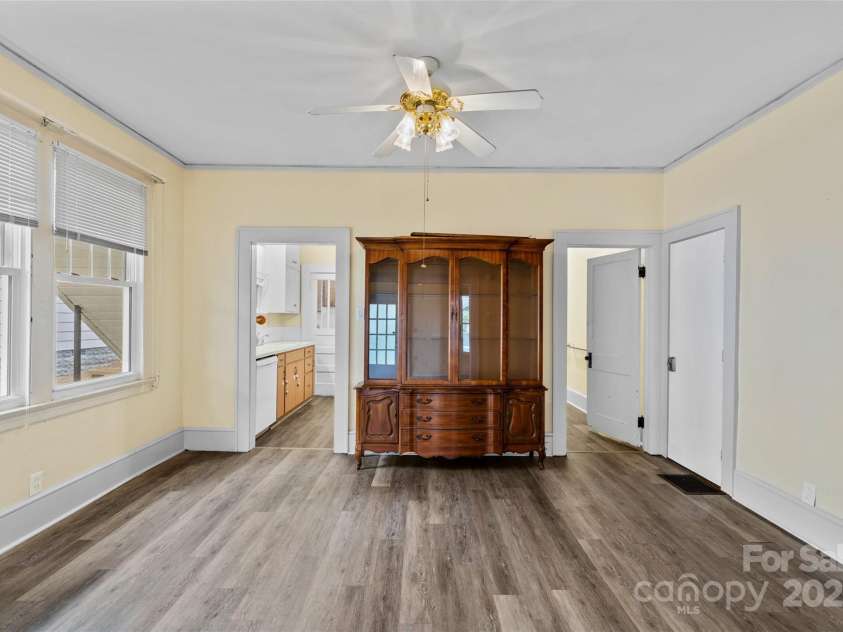23 & 25 Oteen Park Place, Asheville, NC 28805.  MLS# CAR4287838, YatesRealty ID 29157. The dining room featured above leads into the kitchen on your left.  To the right is the central hallway leading you to the bathroom and tthe wo bedrooms.
