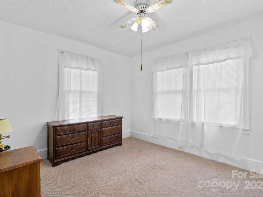 23 & 25 Oteen Park Place, Asheville, NC 28805.  MLS# CAR4287838, YatesRealty ID 29157. The larger of the two bedrooms in unit 23 has two closets and wonderful natural light.