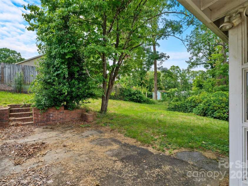 23 & 25 Oteen Park Place, Asheville, NC 28805.  MLS# CAR4287838, YatesRealty ID 29157. The patio is the perfect spot to grill, have a container garden or enjoy the sun!