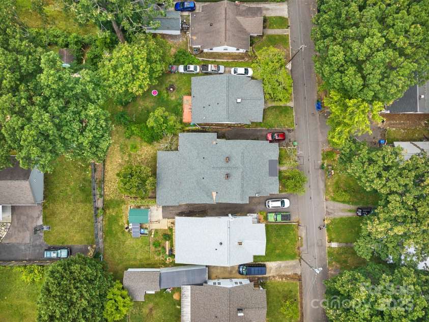 23 & 25 Oteen Park Place, Asheville, NC 28805.  MLS# CAR4287838, YatesRealty ID 29157. The spacious home is nestled in an established east Asheville neighborhood near the VA Hospital and Ingles. It is just 8 to 10 minutes away from downtown Asheville, which is super convenient!