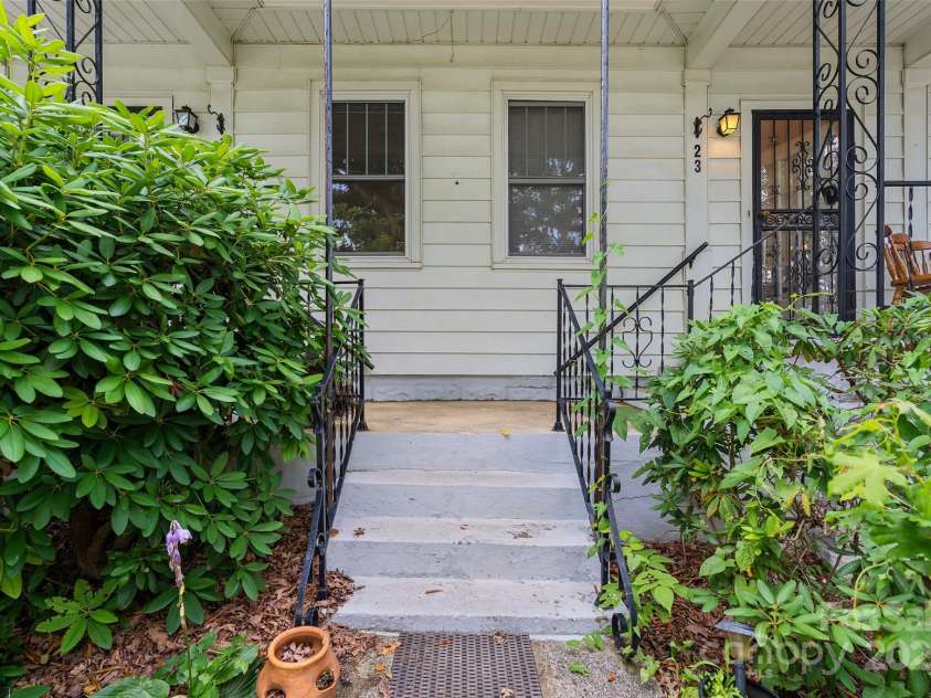 23 & 25 Oteen Park Place, Asheville, NC 28805.  MLS# CAR4287838, YatesRealty ID 29157. This is the main entrance to the cottage style duplex, where you will see central steps leading to the covered front porches. Unit 23 is to the right of the front entrance, and unit 25 is to the left.