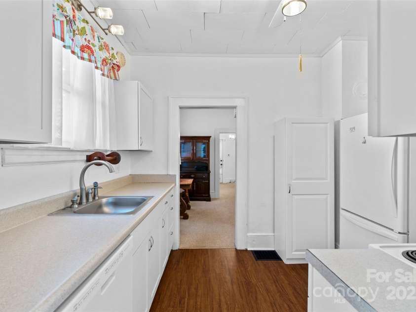 23 & 25 Oteen Park Place, Asheville, NC 28805.  MLS# CAR4287838, YatesRealty ID 29157. View of the kitchen with a lot of counter space and looking back toward the dining room.