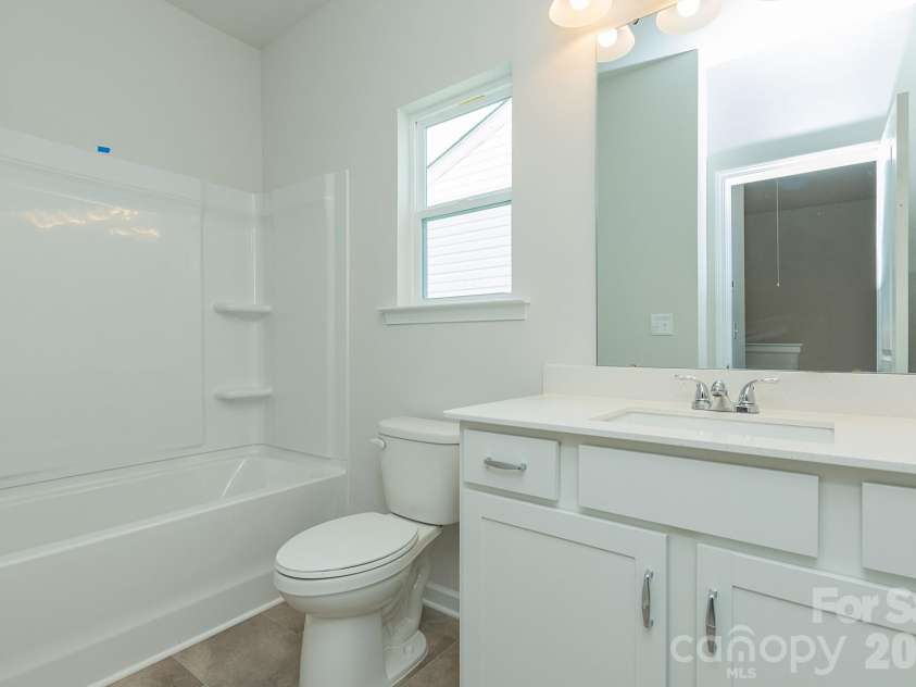 5617 Ringneck Road, Charlotte, NC 28216.  MLS# CAR4363350, YatesRealty ID 29157. Hall bathroom