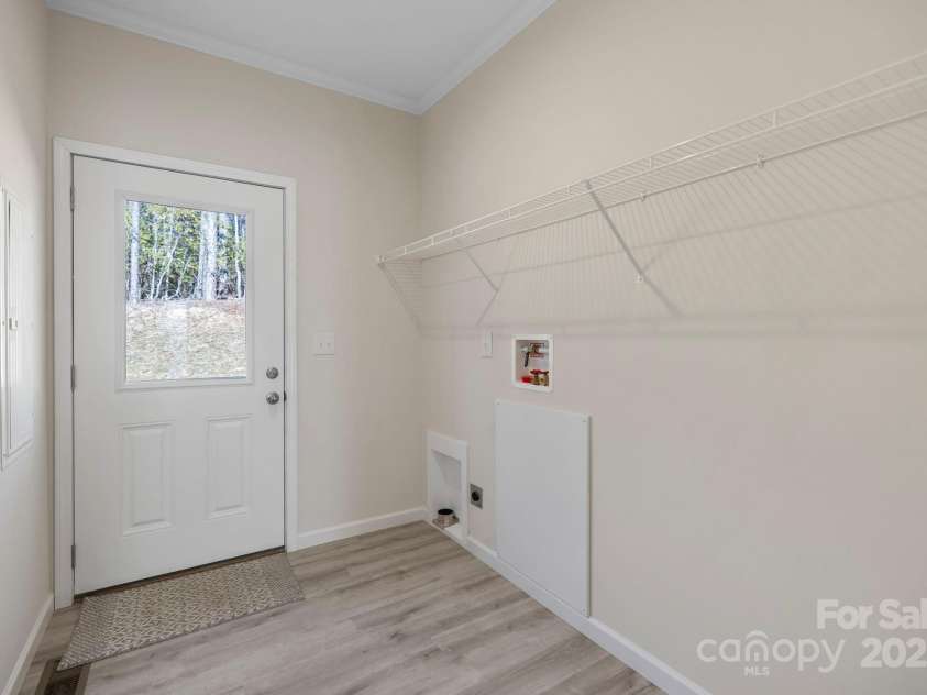 1663 Williamson Creek Road, Pisgah Forest, NC 28768.  MLS# CAR4194692, YatesRealty ID 29168. Laundry room/back door