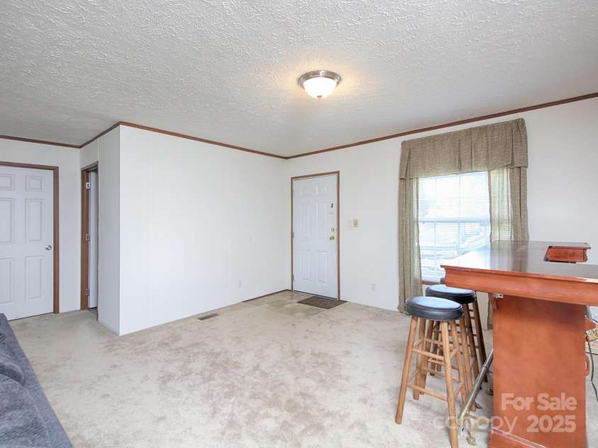 1858 Cody Court, Newton, NC 28658.  MLS# CAR4283160, YatesRealty ID 29171. Front Door and Dining room