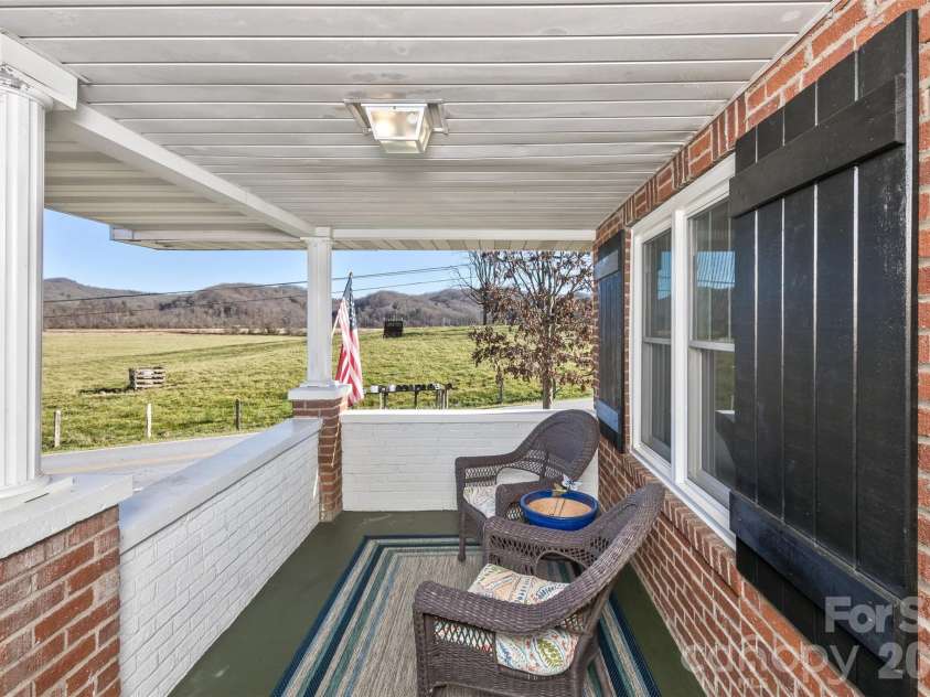 522 Calvert Road, Brevard, NC 28712.  MLS# CAR4381779, YatesRealty ID 2918. Beautiful front porch with mountain/pastoral views.