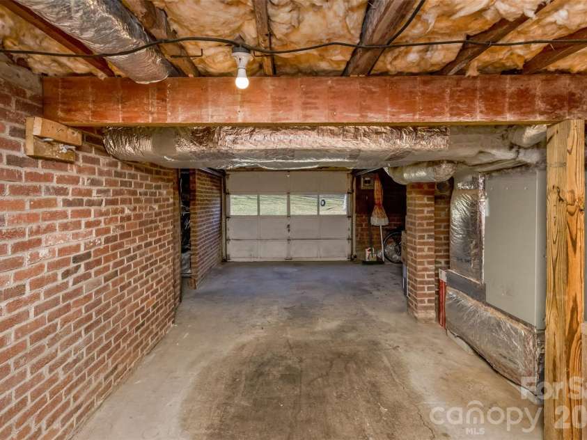 522 Calvert Road, Brevard, NC 28712.  MLS# CAR4381779, YatesRealty ID 2918. Garage/unfinished basement.